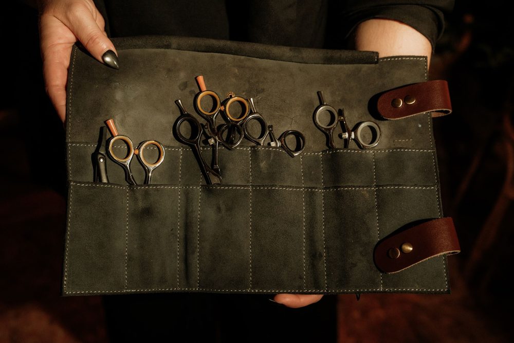 Professional shears in a leather roll